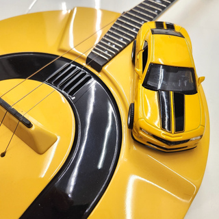35. Electric domra in Camaro Yellow colour.